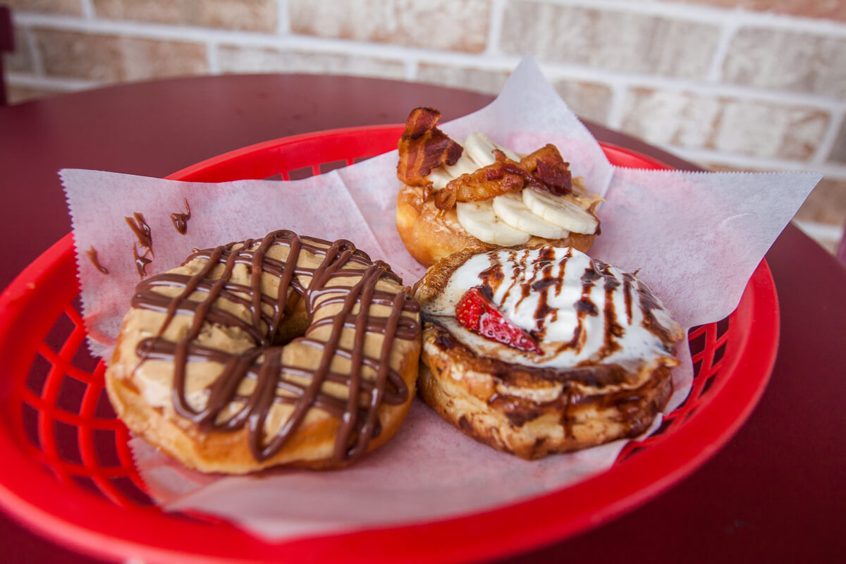 Donuts are the ultimate splurge food! Check out our favorite donut joints across the USA for the ultimate flavor combinations to satisfy your craving. | www.eatworktravel.com - The luxury, adventure couple!